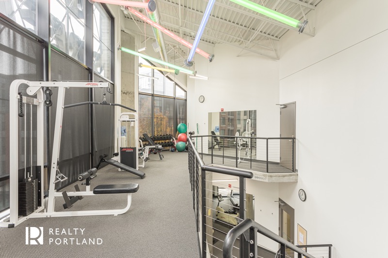 Streetcar Lofts weight room with strength training equipment